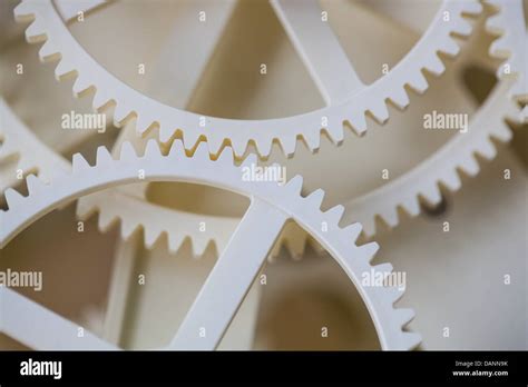 White Gear Bite Each Other Stock Photo Alamy