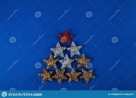 Brilliant Red Gold Silver Christmas Star On Blue Background Stock