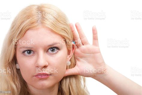 Woman Eavesdropping With Hand Behind Her Ear Stock Photo Download