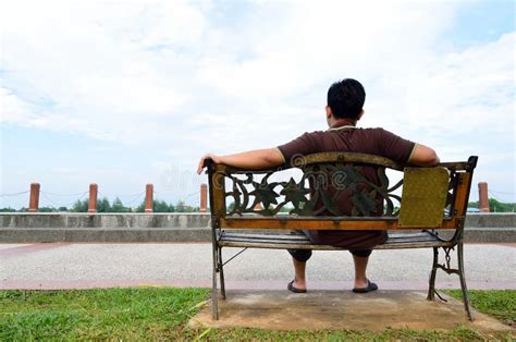 Young Man Sit On The Bench Stock Photography Image 33633112
