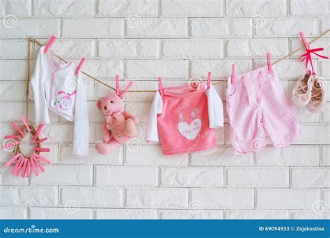 Baby Clothes Hanging On The Wall Stock Image Image Of Bloom Delicate