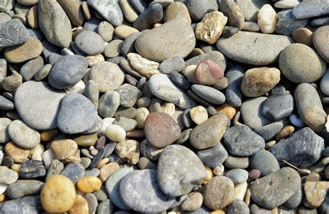 Three Photos Of Small Stones And Beach Sand
