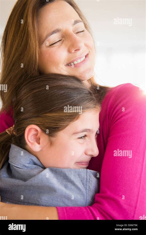 Close Up Of Caucasian Mother And Daughter Hugging Stock Photo Alamy