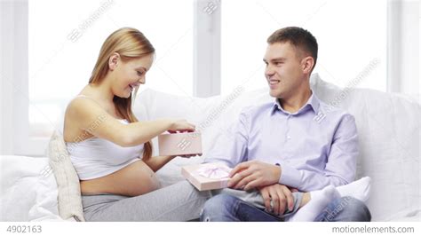 Happy Husband Giving Present To His Pregnant Wife Stock Video Footage