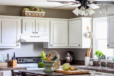 To iron out the details, we turned to the experts. white kitchen | Painting kitchen cabinets, Tan kitchen walls, Kitchen cabinets