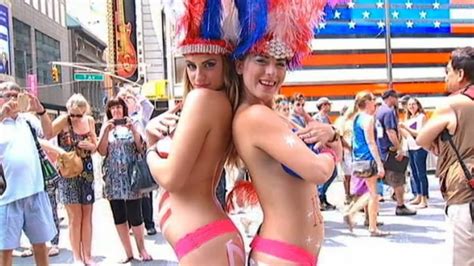 Topless Women Posing In Times Square Are Causing A Stir