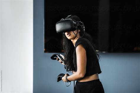 South East Asian Girl Playing Vr Game By Stocksy Contributor Irina