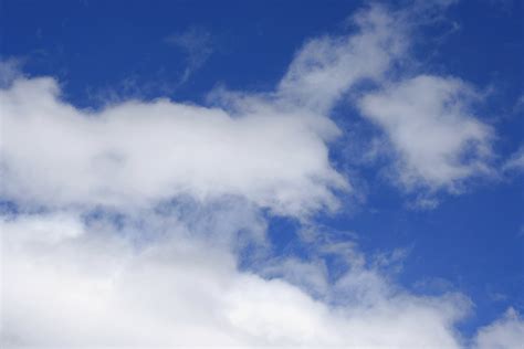Blue Sky With Fluffy White Clouds Picture Free Photograph Photos