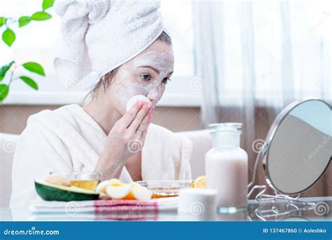 Beautiful Happy Young Woman With Natural Cosmetic Mask On Her Face