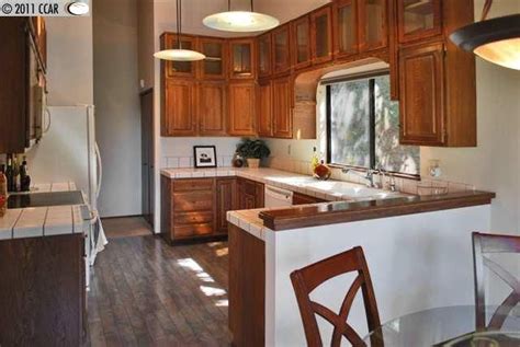 Kitchen cabinets remodel ideas | briwax tudor brown | easy & cheap do you have builder's grade oak cabinets in your home and want to update for cheap and e. Image result for updating golden oak cabinets | Wood floor kitchen, Oak kitchen, Oak cabinets