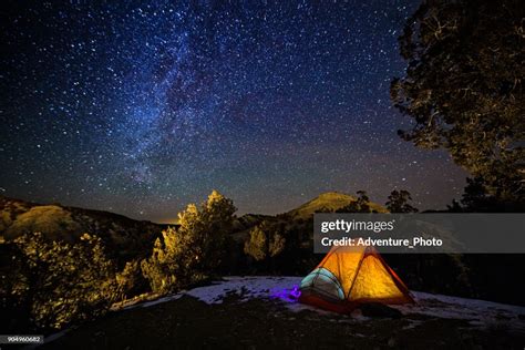 Camping In A Tent Under The Stars And Milky Way Galaxy High Res Stock