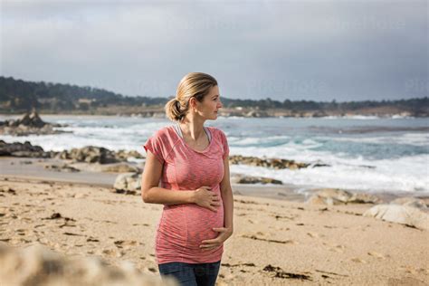 Pregnant Woman Holding Her Bump Stock Photo Pixeltote