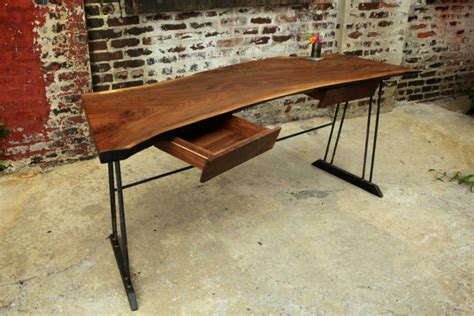 Crafted of reclaimed pine, this rustic desk is a showpiece that highlights the beauty of the wood's natural markings and organic grain while keeping a caring eye on our environment. Make Your Office More Eco-Friendly With a Reclaimed Wood Desk