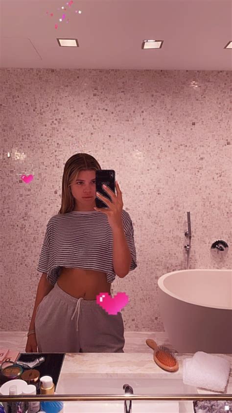 sofia richie shows abs in striped crop top t shirt and sweats