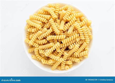 Dried Fusili Italian Pasta In A Round Bowl Ready To Be Cooked Isolated