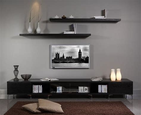 She painted a black frame on the wall, which totally hides the tv. 30 Ways To Decorate The TV wall - Bored Art