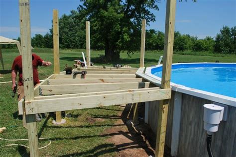 Our Pool Deck Project Decks Pool Designs First Deck Boards Go On Deck Building Plans Pool