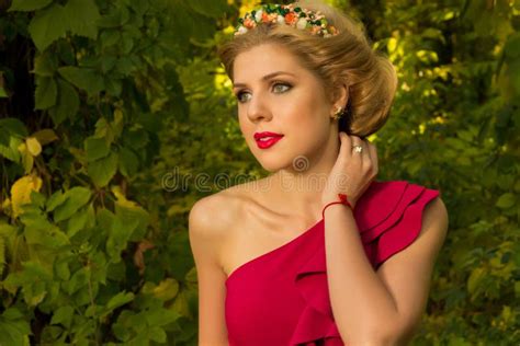 Beautiful Girl In Red Dress Posing On A Background Of Leaves Stock Image Image Of Model Park