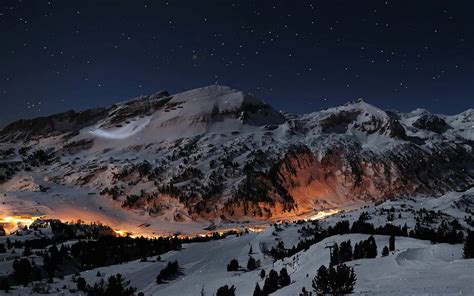 Download A Breathtaking Winter Panorama Of The Swiss Alps Wallpaper