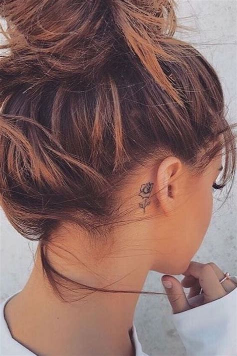 Small cross tattoos for the hands and fingers. flower tattoo behind ear | Behind ear tattoos, Behind ear ...