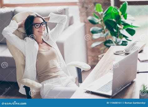 Nice Independent Cute Woman In White Suit Formal Wear Glasses Sitting On Chair At Her Desk