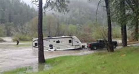 Trailer Pulled From Flooded Camp Grounds After Owner Woke Up With River On Both Sides Video