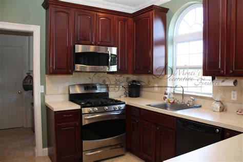 Originally Oak Cabinets Transformed By Restaining The Wood With A Faux