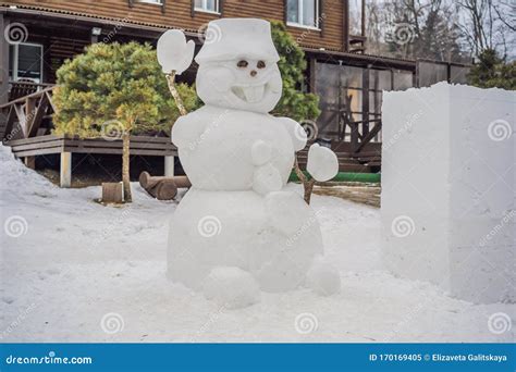 Winter Wonderland With A Funny Smiling Snowman In A Snowy Park White