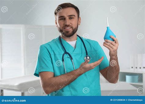 Doctor Holding Rubber Enema In Room Stock Photo Image Of Care Doctor