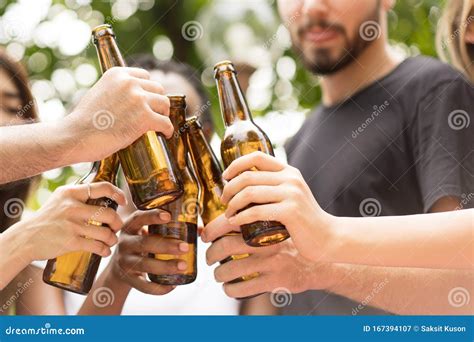 Group Of Friends Toasting Beers Outdoors Party People Drinks Toast