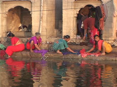 Women Wash Clothes In The Ganges River Stock Video Footage 1386098