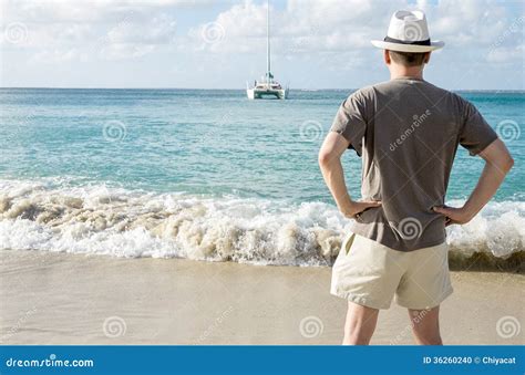 Back View Of A Man Standing On A Beach Stock Photo Image Of Saint
