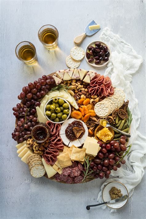 My grandfather was the master of charcuterie boards and taught me how to put one together that's not only tasty, but also beautiful. Epic Charcuterie Cheese Board on a Budget - Bessie Bakes