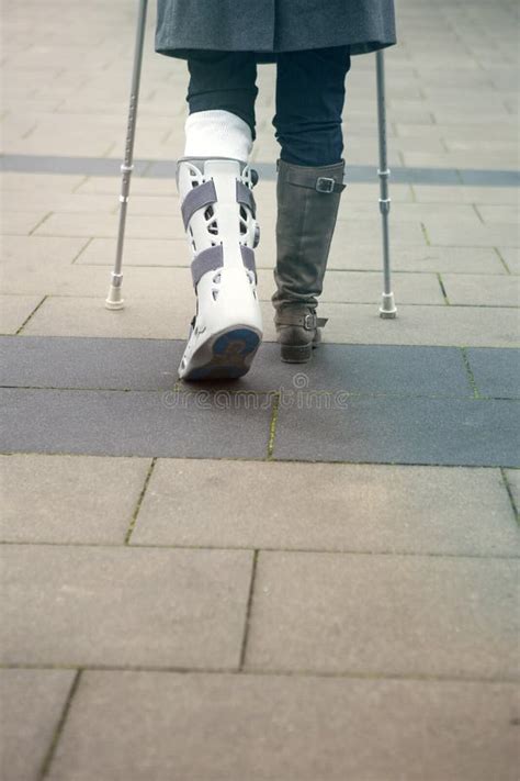 Closeup Of Woman Walking With Crutches Stock Photo Image Of Brace