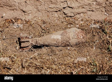 Partially Buried Unexploded 82mm Mortar Round Helmand Province