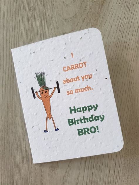 A Card With A Cartoon Carrot Holding A Barbell On Its Head And Saying