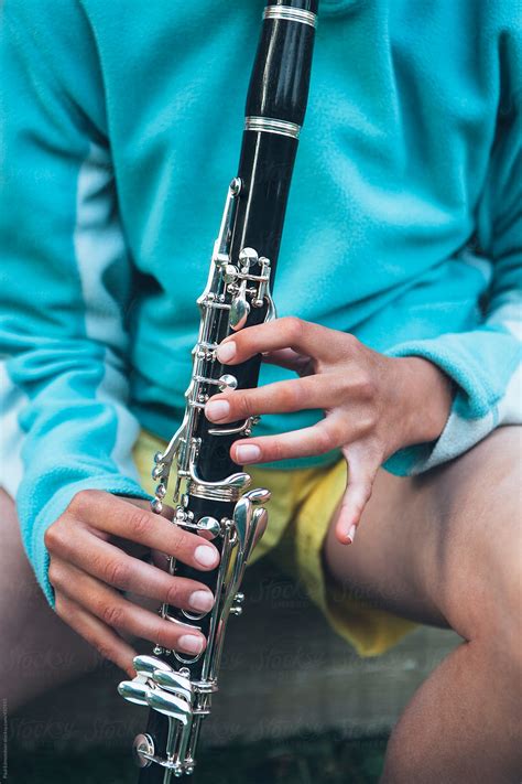 close up of girl playing clarinet by rialto images clarinet wind instrument stocksy united