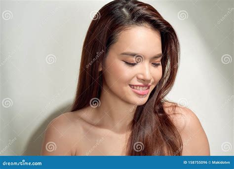 Beautiful Young Woman Looking Down And Thinking With Copy Space