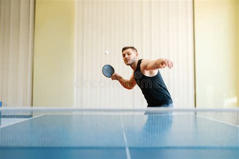 Man With Racket And Ball Playing Ping Pong Indoors Stock Image Image