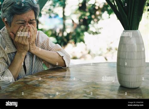Stressed Depressed Fatigued Sad Upset Asian Old Asian Elderly Senior Elder Woman Sitting In