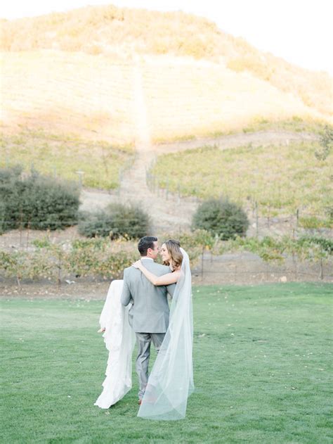 triunfo creek vineyard wedding bride and groom portraits groom carrying bride malibu wedding