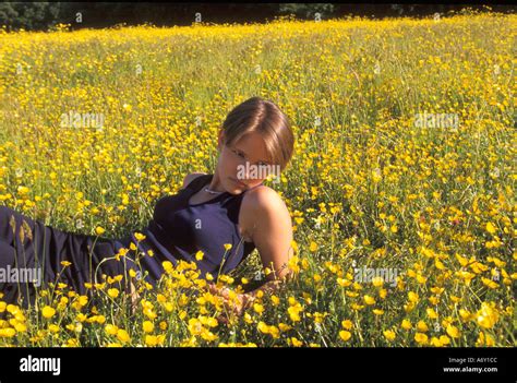 Teenage Girl Looking Wistful And Thoughtful Alone In A Field Of