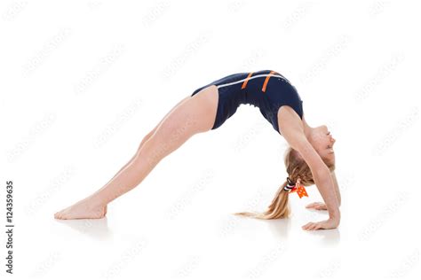 Gymnast Side View Of Young Girl Doing A Backbend Bridge Stock Photo