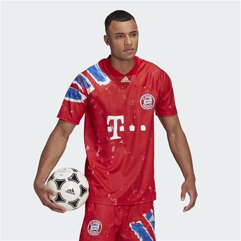 Human race above back hem. Adidas FC Bayern Human Race Jersey - True Red / White