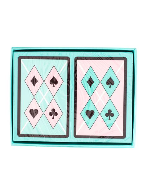 The boxes featured a solid color with a unique gold colored design. Tiffany & Co. Playing Cards Set - Decor & Accessories - TIF67007 | The RealReal