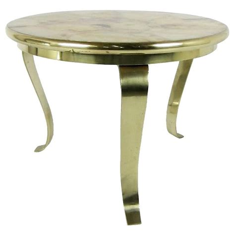 The unique armato bronze side table, created by ad100 list, high end designer kelly wearstler, makes a great conversation piece. Bronze Side Table with Onyx Top by Muller For Sale at 1stdibs
