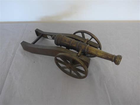 Canon is a global leader in photographic and digital imaging solutions. CANON miniature type Griboval en bronze.