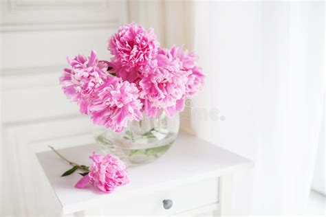 Pink Peonies In Glass Vase Flowers On A White Table Near The Window Morning Light In The Room