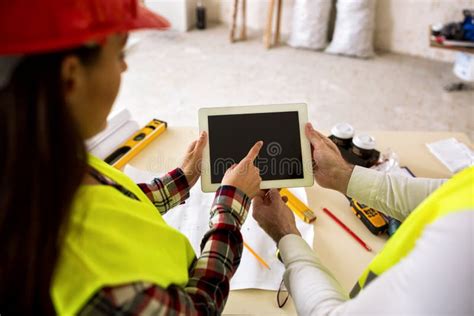 engineers with tablet at construction site stock image image of