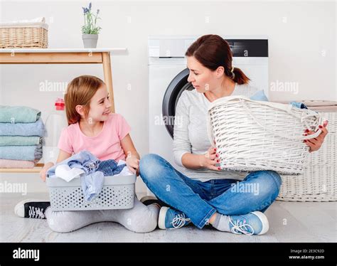 Little Girl Helping Mother During Washing Stock Photo Alamy